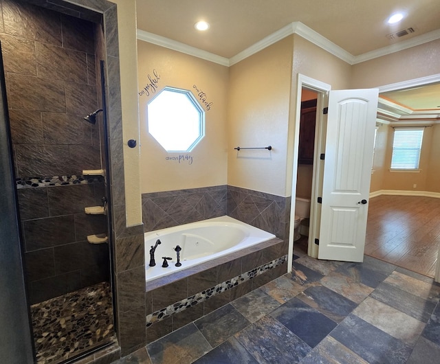 bathroom with toilet, crown molding, and independent shower and bath