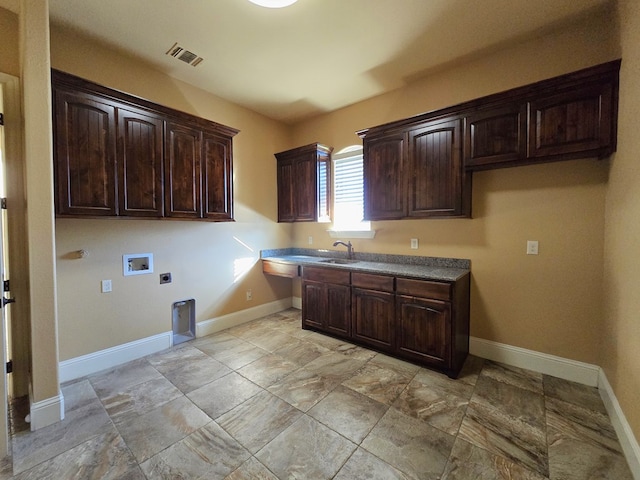 washroom featuring sink, hookup for a washing machine, cabinets, and hookup for an electric dryer