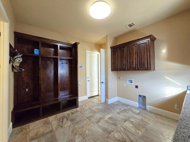 5416 Alysheba, Midland, TX 79705 - laundry area with hookup for an electric dryer, washer hookup, and cabinet space