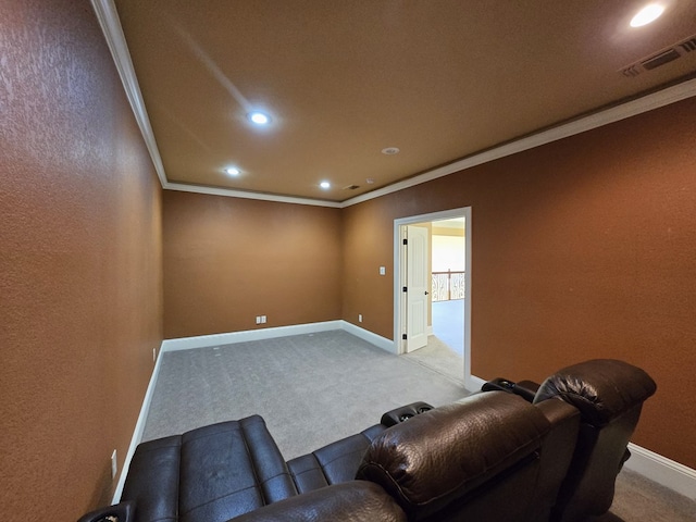 home theater with light carpet and ornamental molding