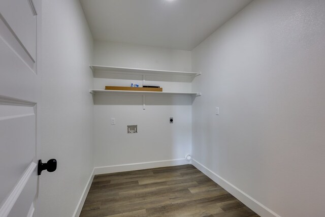 washroom featuring hookup for an electric dryer, dark wood finished floors, baseboards, and hookup for a washing machine
