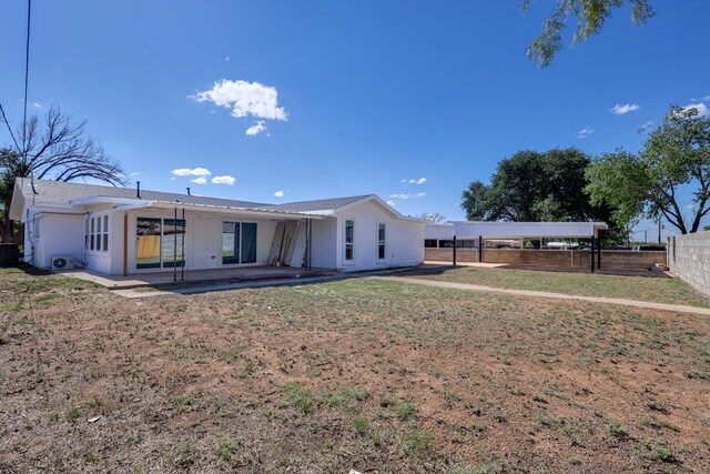 view of front facade featuring a patio and stucco siding