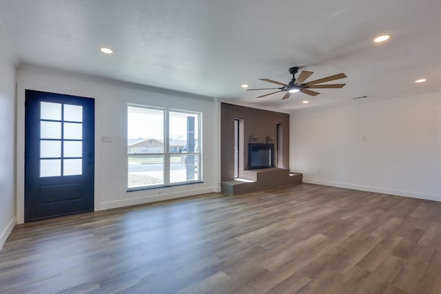 unfurnished living room with recessed lighting, baseboards, dark wood-style floors, and ceiling fan