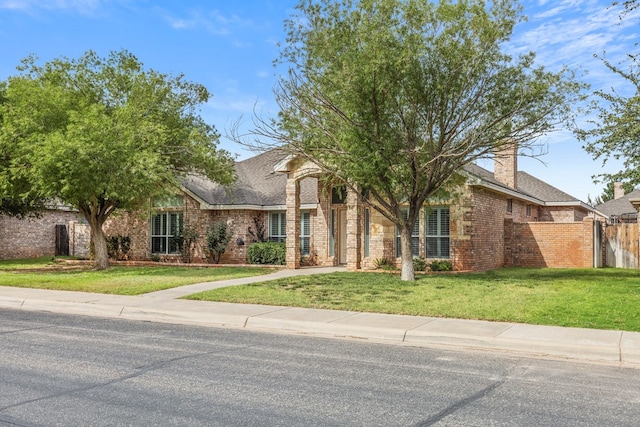 4906 Crista Ln, Midland, TX 79707 - view of front of house with brick siding and a shingled roof
