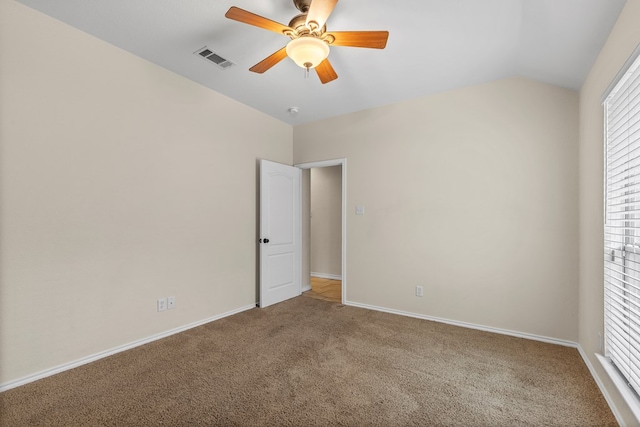 4906 Crista Ln, Midland, TX 79707 - unfurnished bedroom featuring carpet flooring, vaulted ceiling, and a ceiling fan