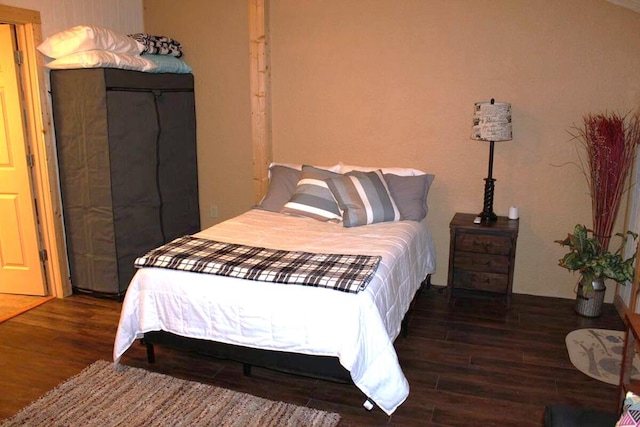 bedroom featuring wood finished floors