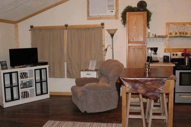 sitting room with lofted ceiling and dark wood-type flooring