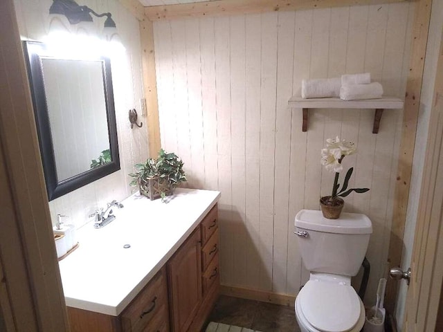 bathroom with toilet and vanity