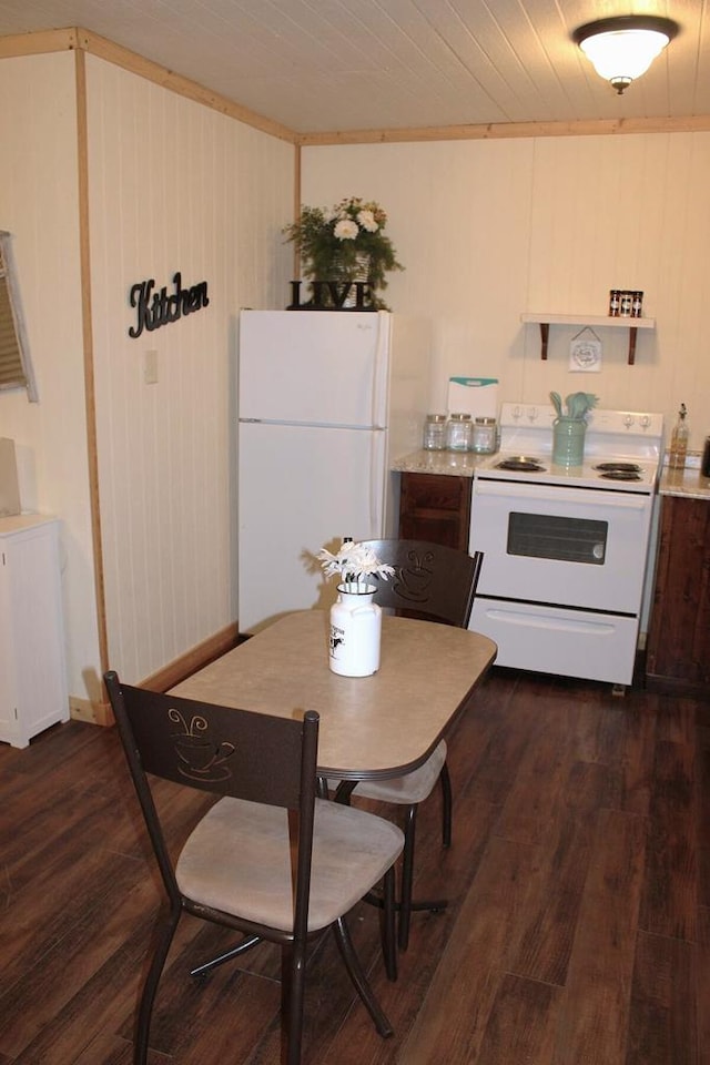 kitchen with white appliances, wood ceiling, dark wood finished floors, and light countertops