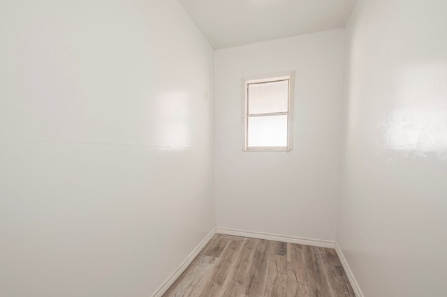 empty room featuring light wood-style flooring and baseboards