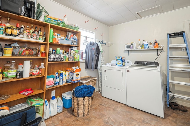 washroom with washer and dryer, attic access, and laundry area