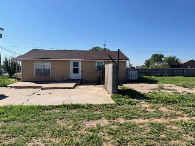 back of house with a yard