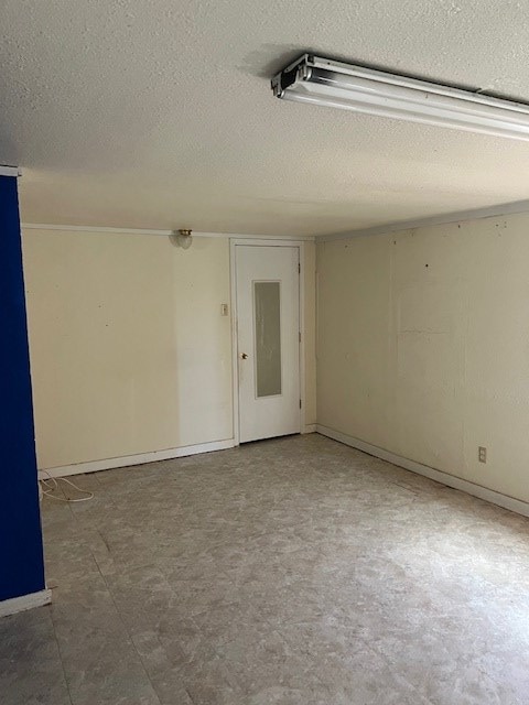 spare room with a textured ceiling