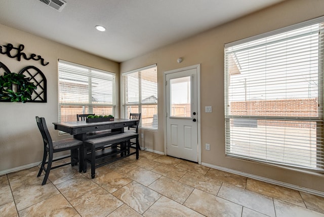 dining area with baseboards and visible vents