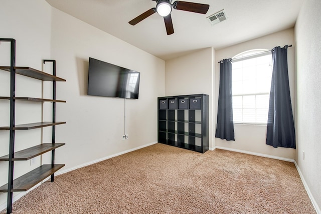 unfurnished bedroom featuring carpet flooring, visible vents, and baseboards