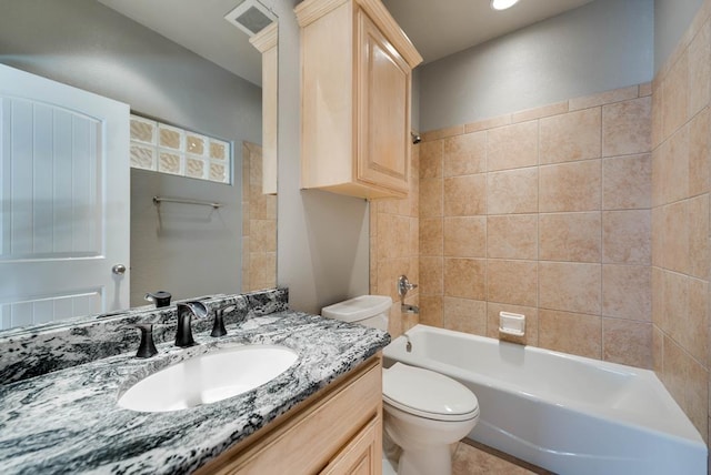 full bathroom with toilet, vanity, and bathtub / shower combination