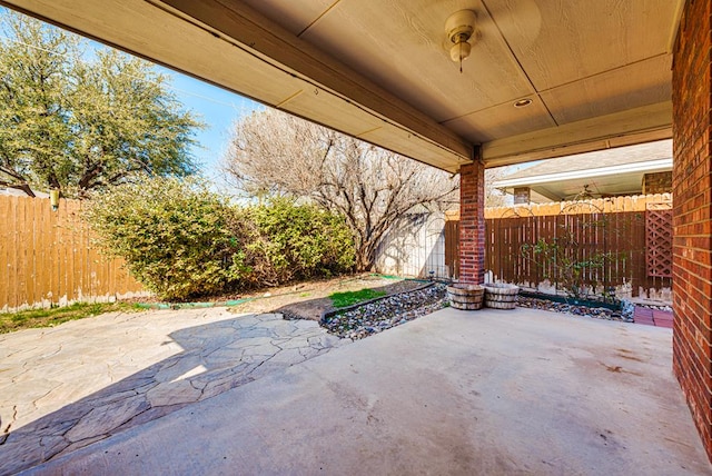 view of patio / terrace featuring fence