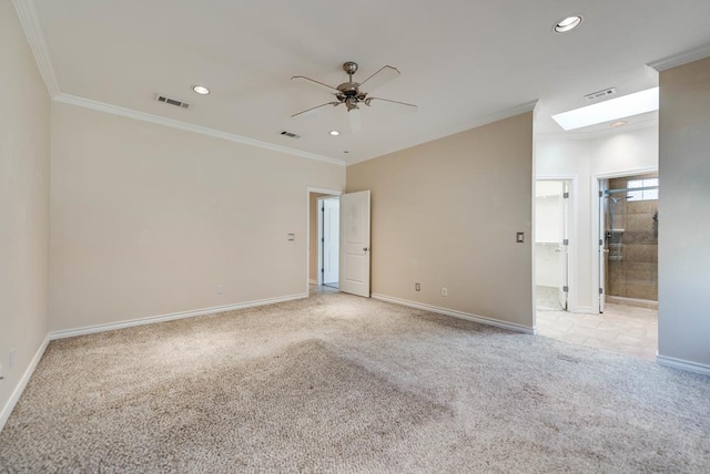 spare room featuring carpet flooring, crown molding, a ceiling fan, recessed lighting, and baseboards