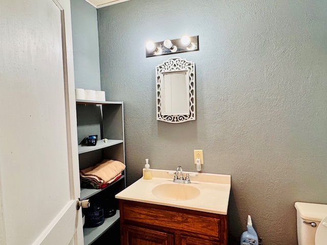 half bath with vanity and toilet