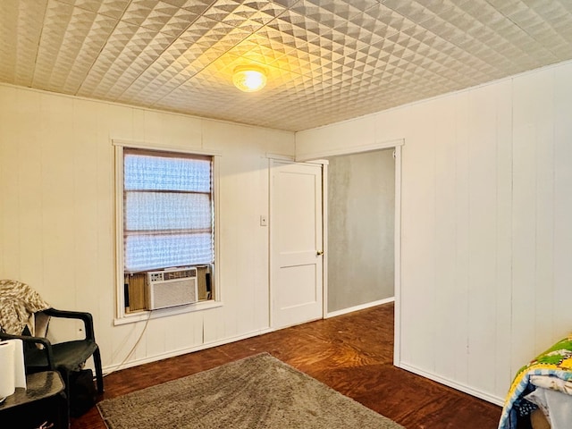 living area featuring wood finished floors and cooling unit