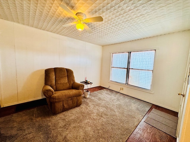 living area with ceiling fan