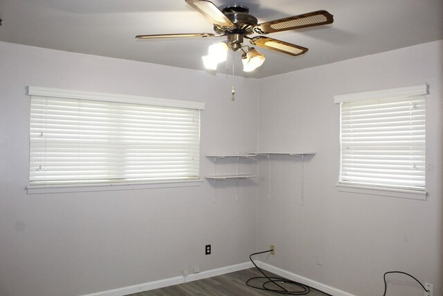 washroom with ceiling fan, a healthy amount of sunlight, and wood-type flooring