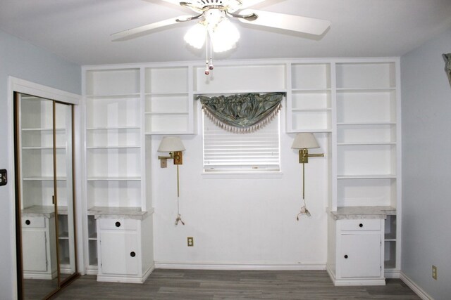 interior space featuring ceiling fan and dark wood-type flooring