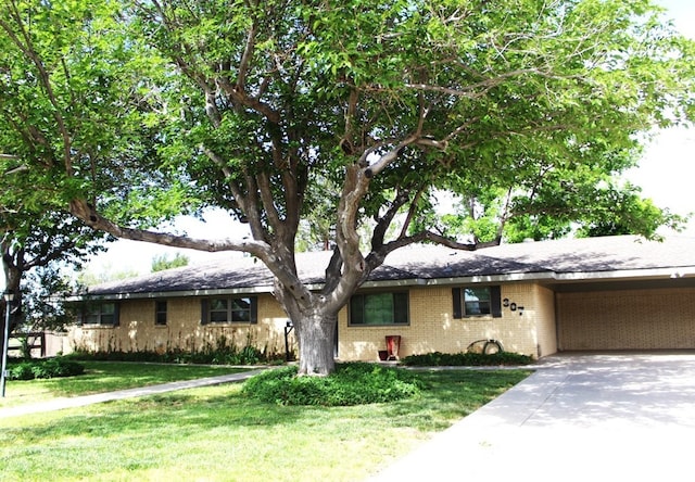 single story home with a front yard and a carport