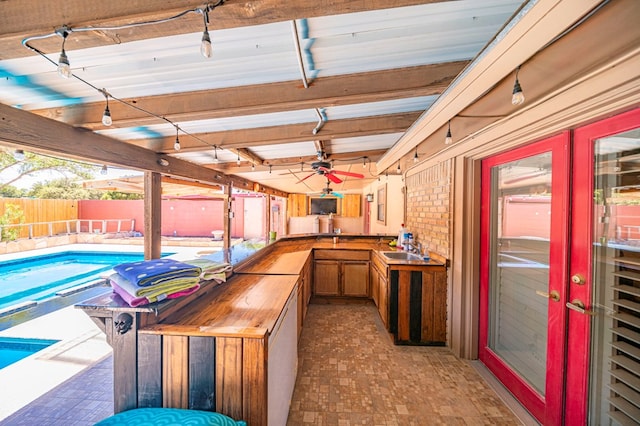 interior space with butcher block counters and sink