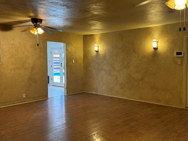 spare room with ceiling fan and wood-type flooring