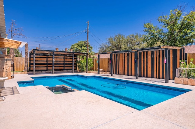 view of swimming pool with an in ground hot tub and a patio area