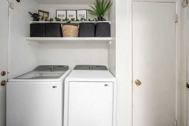 laundry area with laundry area and washing machine and clothes dryer