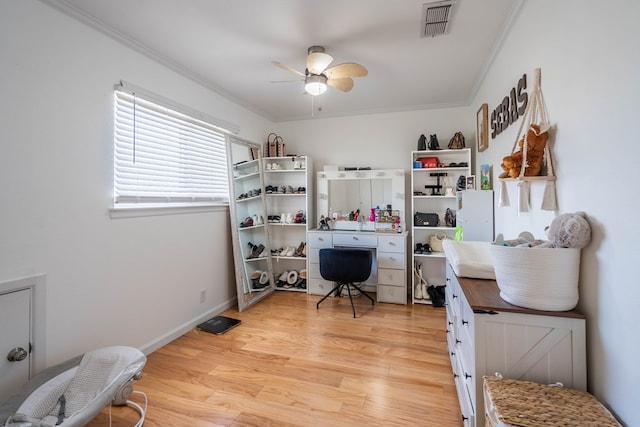 bedroom featuring crown molding, visible vents, a ceiling fan, light wood-type flooring, and baseboards