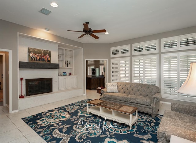 4300 Tumbleweed Trl, Midland, TX 79707 - living area featuring a ceiling fan, tile patterned floors, plenty of natural light, a fireplace, and recessed lighting