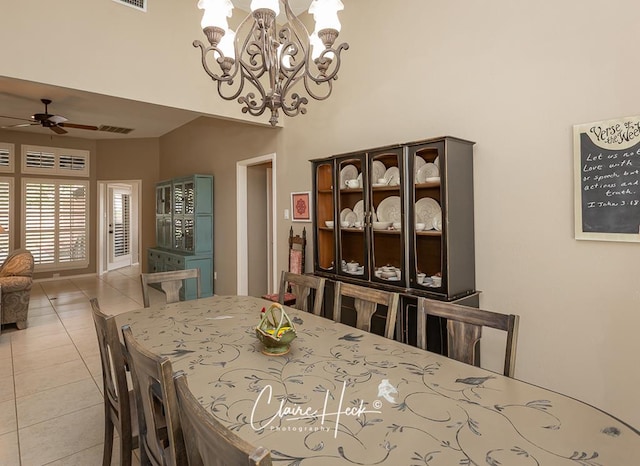 4300 Tumbleweed Trl, Midland, TX 79707 - dining space featuring ceiling fan, a chandelier, and light tile patterned floors
