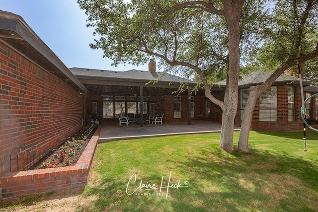 4300 Tumbleweed Trl, Midland, TX 79707 - view of green lawn featuring a patio
