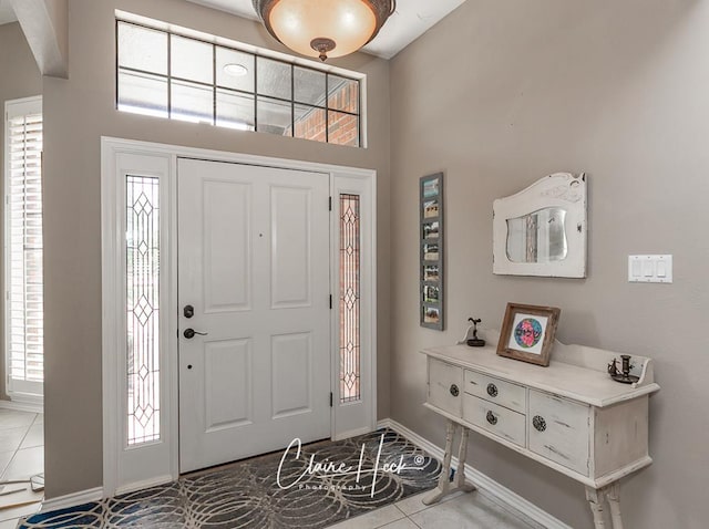 4300 Tumbleweed Trl, Midland, TX 79707 - tiled foyer with healthy amount of natural light, baseboards, and a towering ceiling