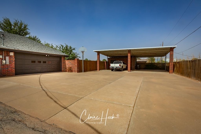 4300 Tumbleweed Trl, Midland, TX 79707 - view of parking featuring a carport and concrete driveway