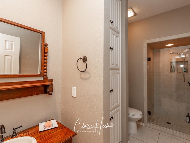 4300 Tumbleweed Trl, Midland, TX 79707 - bathroom featuring toilet, a shower stall, tile patterned floors, and vanity