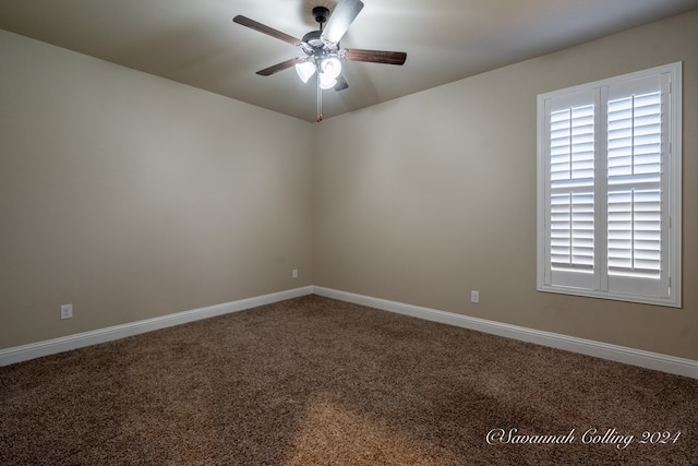 carpeted empty room featuring ceiling fan