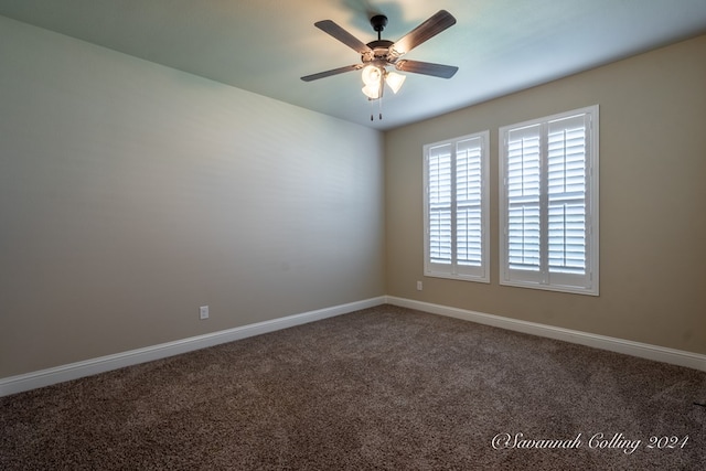 unfurnished room featuring ceiling fan and carpet floors