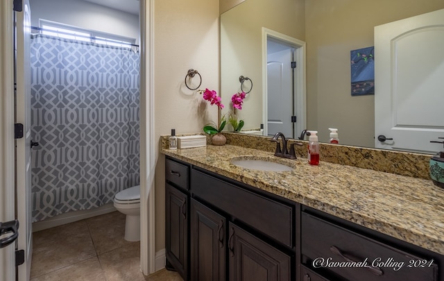 bathroom with tile patterned floors, vanity, and toilet