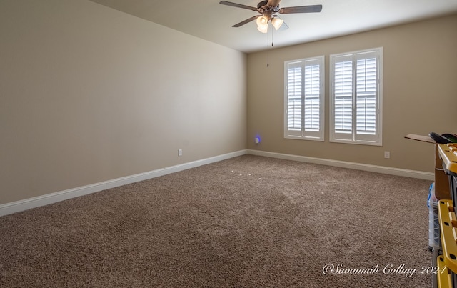 carpeted spare room featuring ceiling fan