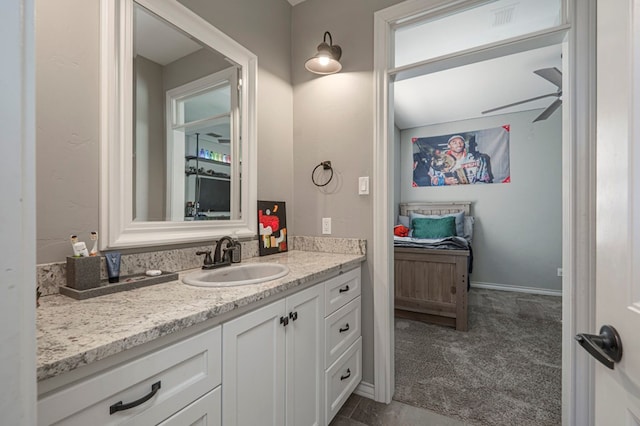 bathroom with ceiling fan and vanity