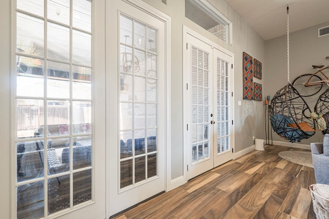 doorway to outside featuring hardwood / wood-style flooring and french doors