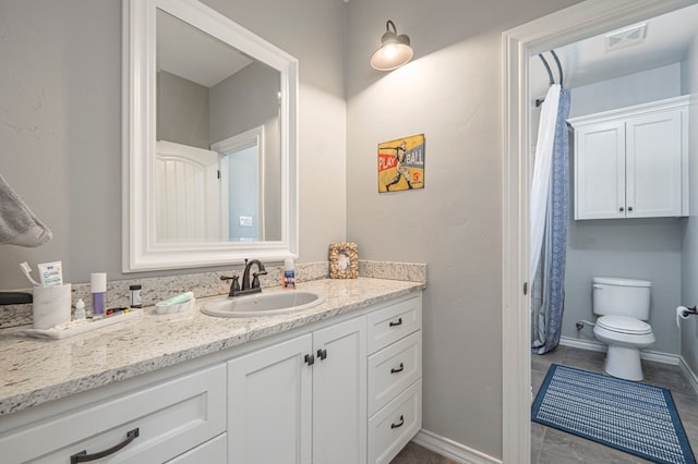 bathroom with vanity and toilet