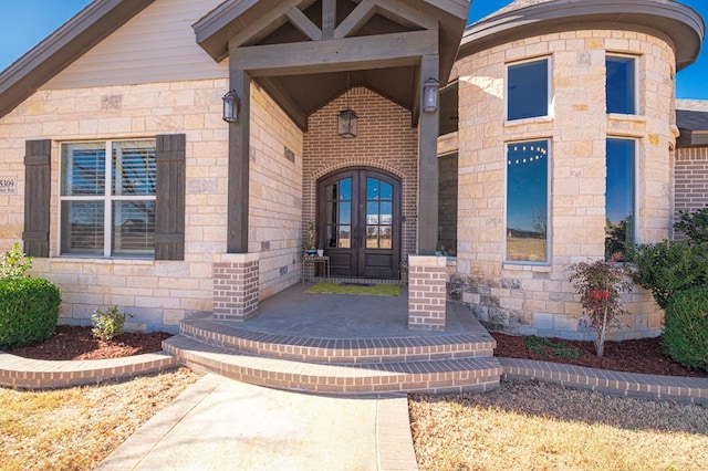 entrance to property featuring french doors