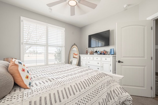 bedroom featuring light carpet and ceiling fan