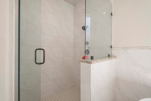 bathroom featuring an enclosed shower