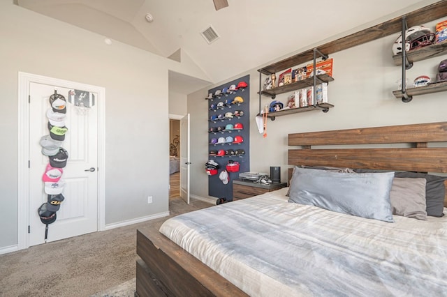 carpeted bedroom with lofted ceiling